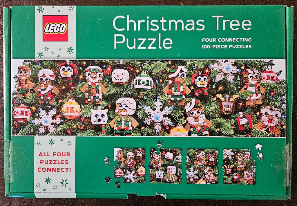 Collection of Christmas-themed ornaments made of building blocks hanging on a pine tree