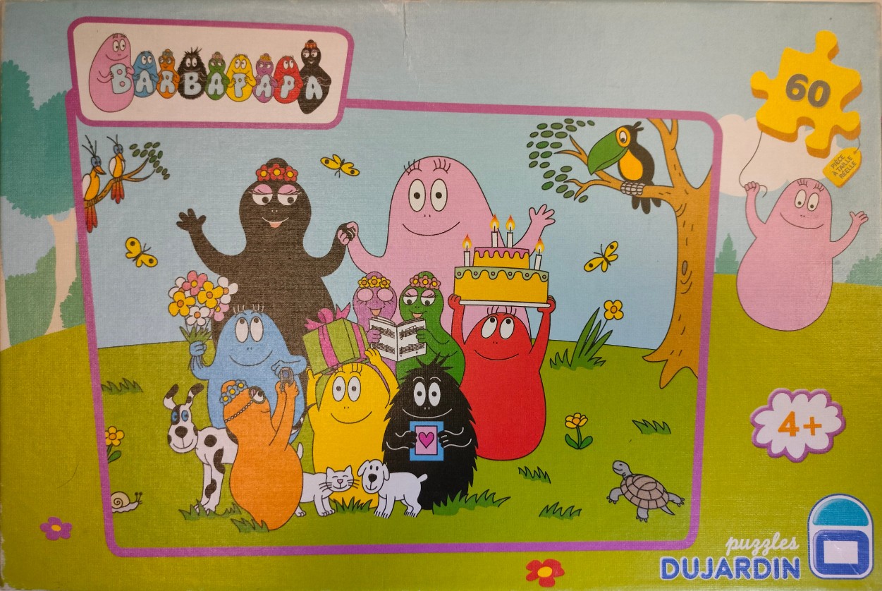 Cartoon illustration of the Barbapapa family celebrating a birthday in a grassy field with animals and cake.