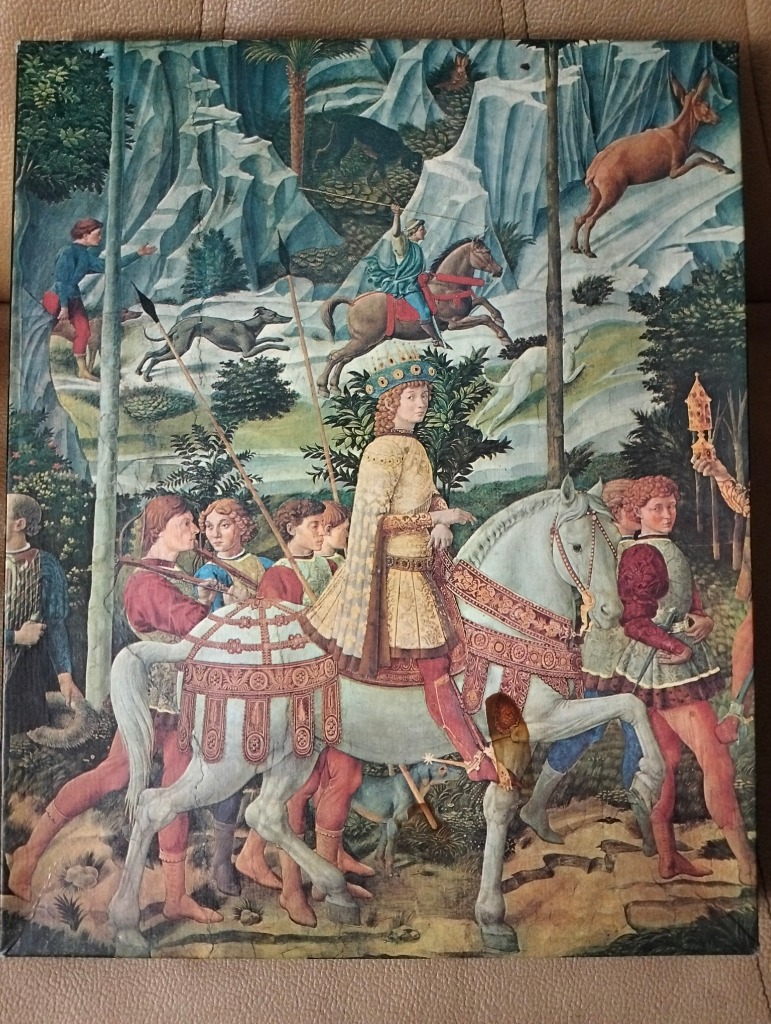 Renaissance painting of a royal hunting party on horseback in a stylized landscape.