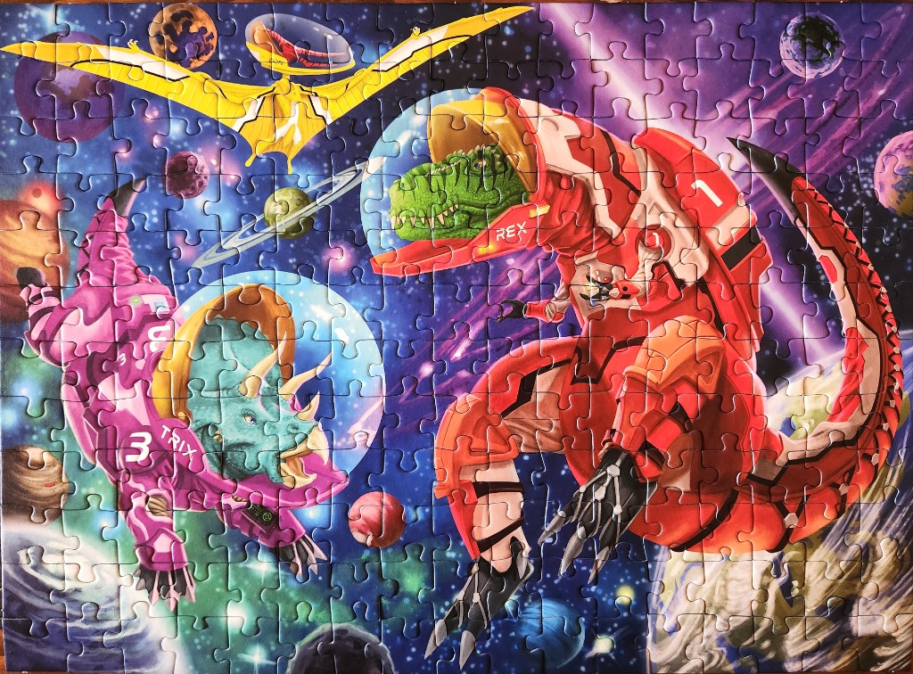 An illustration of three space-faring dinosaurs in futuristic gear floating in deep space against a nebula backdrop.