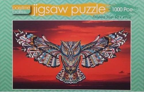 A stylized owl with intricate geometric patterns flying against a deep red sunset.