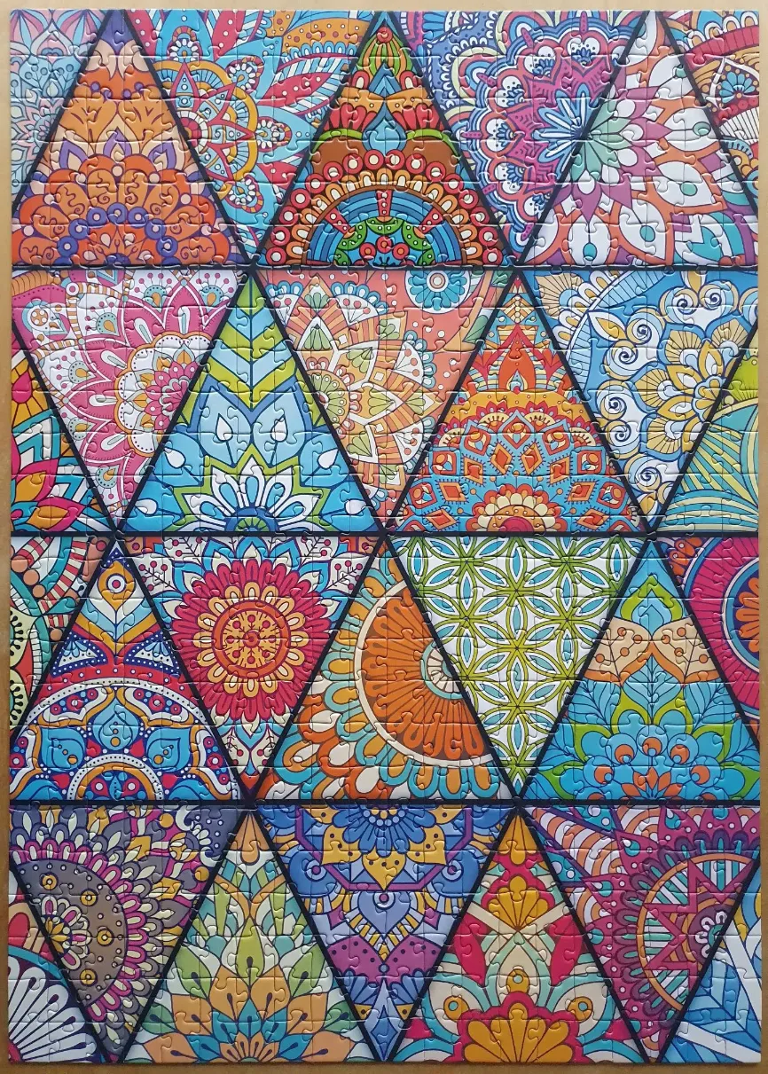 A geometric pattern featuring interconnected triangles filled with intricate, multi-colored mandala-style floral designs.