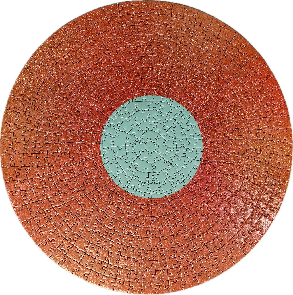 A circular image featuring a solid mint green center circle surrounded by a large, glittery orange ring.
