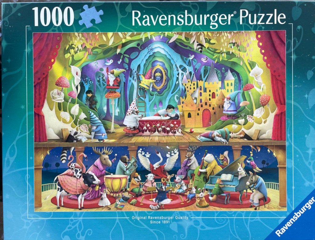 A two-tiered fantasy illustration featuring a scene of Snow White on the top level and a woodland animal orchestra below.