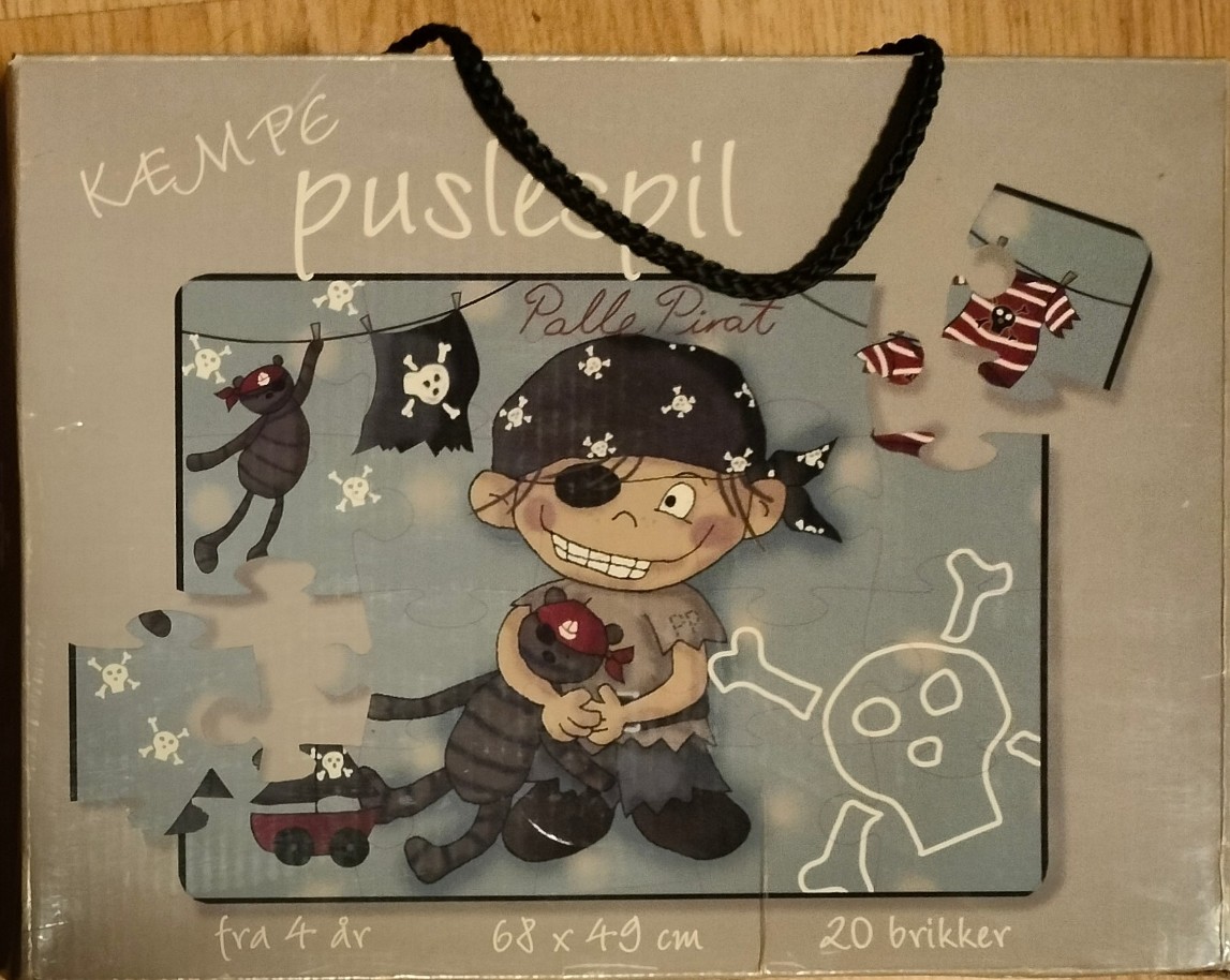 Cartoon illustration of a young pirate boy holding a stuffed animal against a light blue background