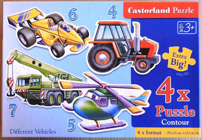 A collection of cartoon-style vehicles including a race car, tractor, crane truck, and helicopter.