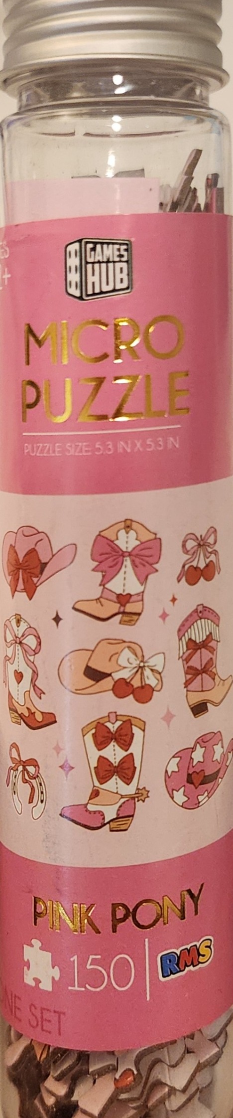 Pattern of illustrated pink and cream cowboy boots, hats, cherries, and horseshoes against a white background.