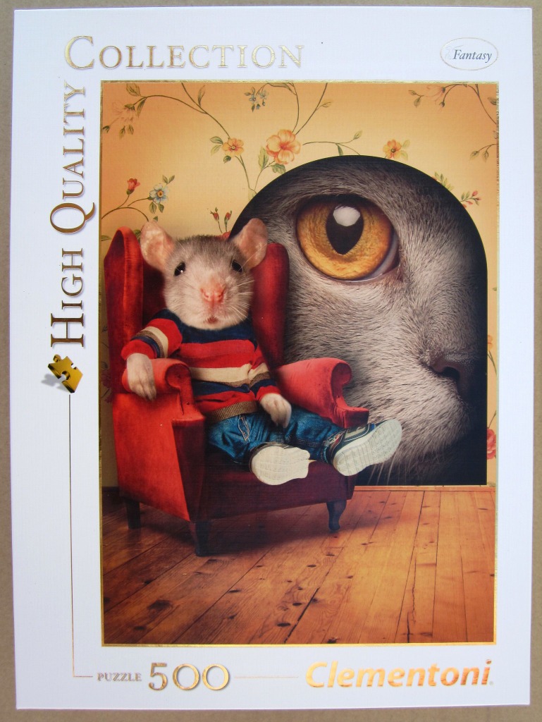 A mouse in a striped sweater sitting in a red armchair in front of a giant cat eye.