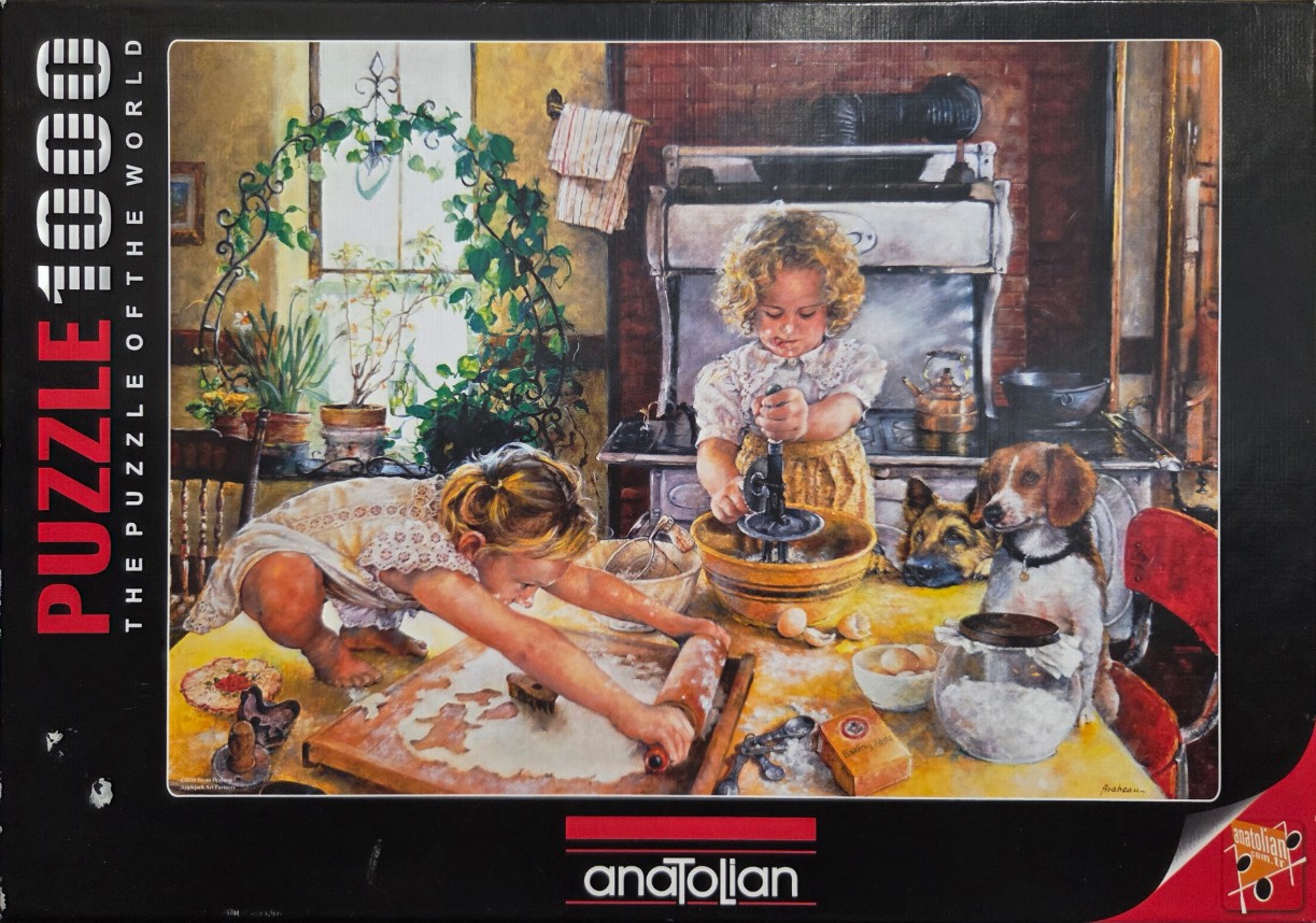Two young girls baking in a kitchen with a dog beside them