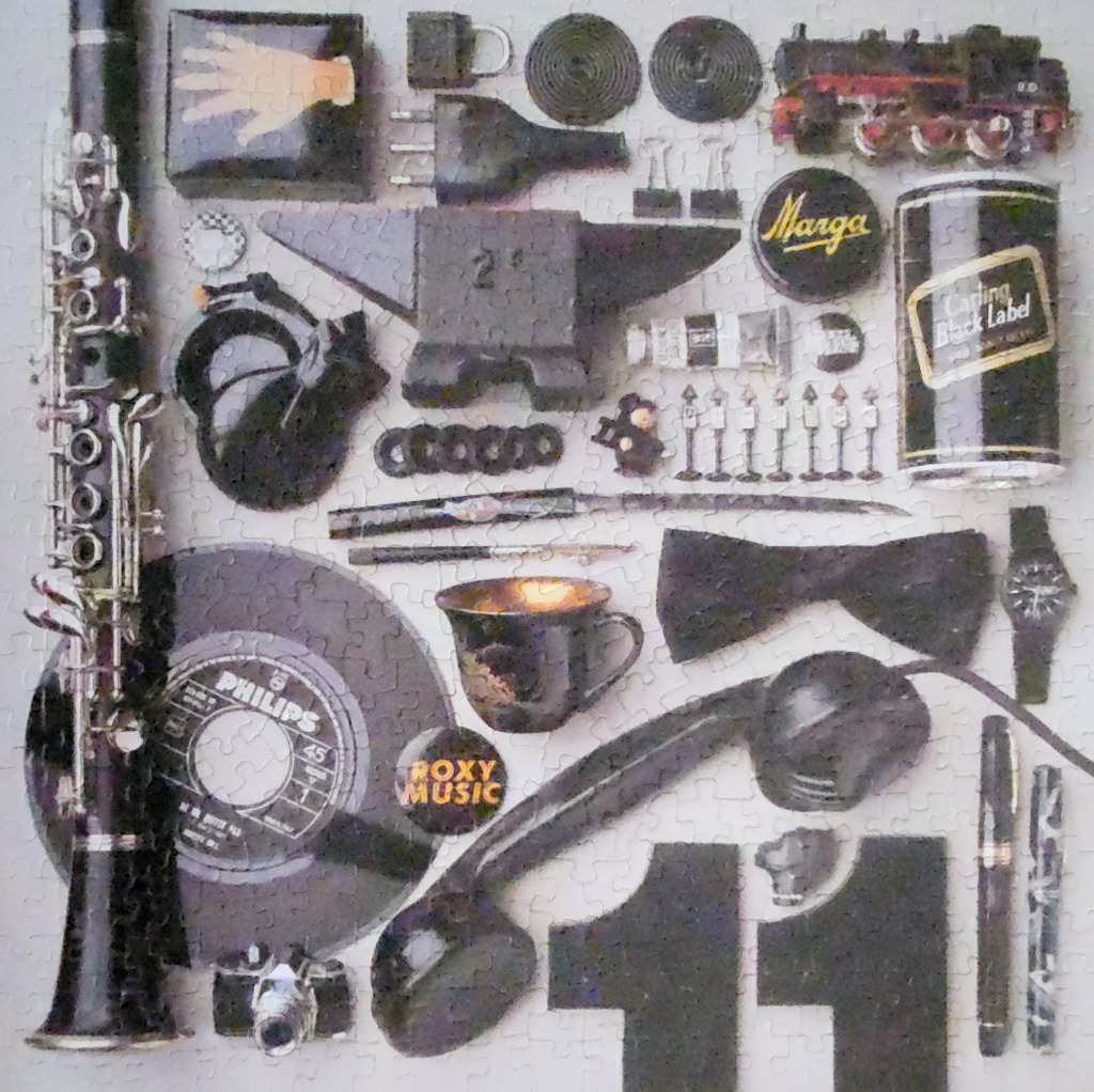 A collection of various black objects organized in a grid against a light grey background.