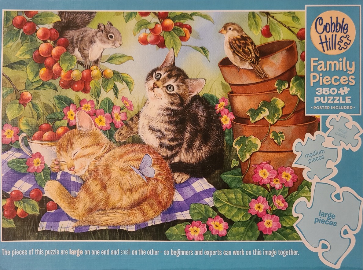 Two kittens in a garden with a squirrel, a bird, and flowers.