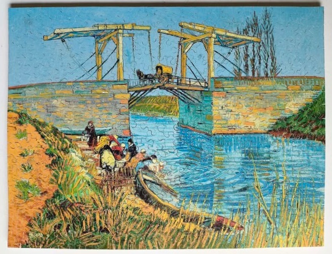 A post-impressionist painting of a wooden drawbridge over a canal with figures washing laundry at the water's edge.