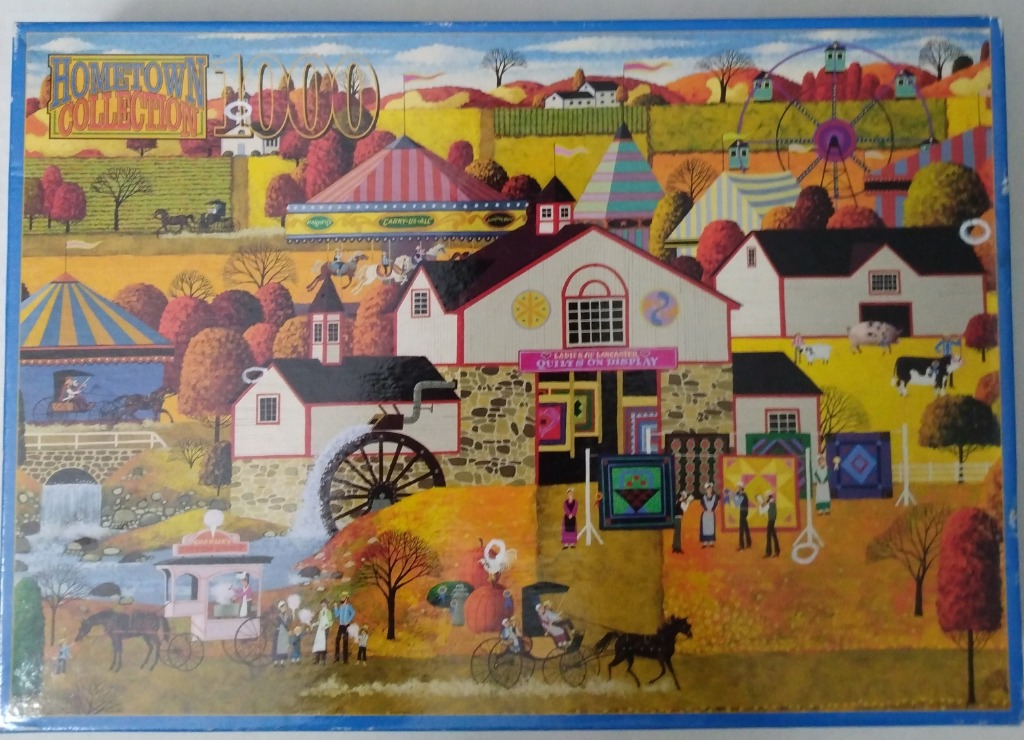 An illustration of an autumn county fair scene with a water mill, barns, ferris wheel, and displayed quilts.