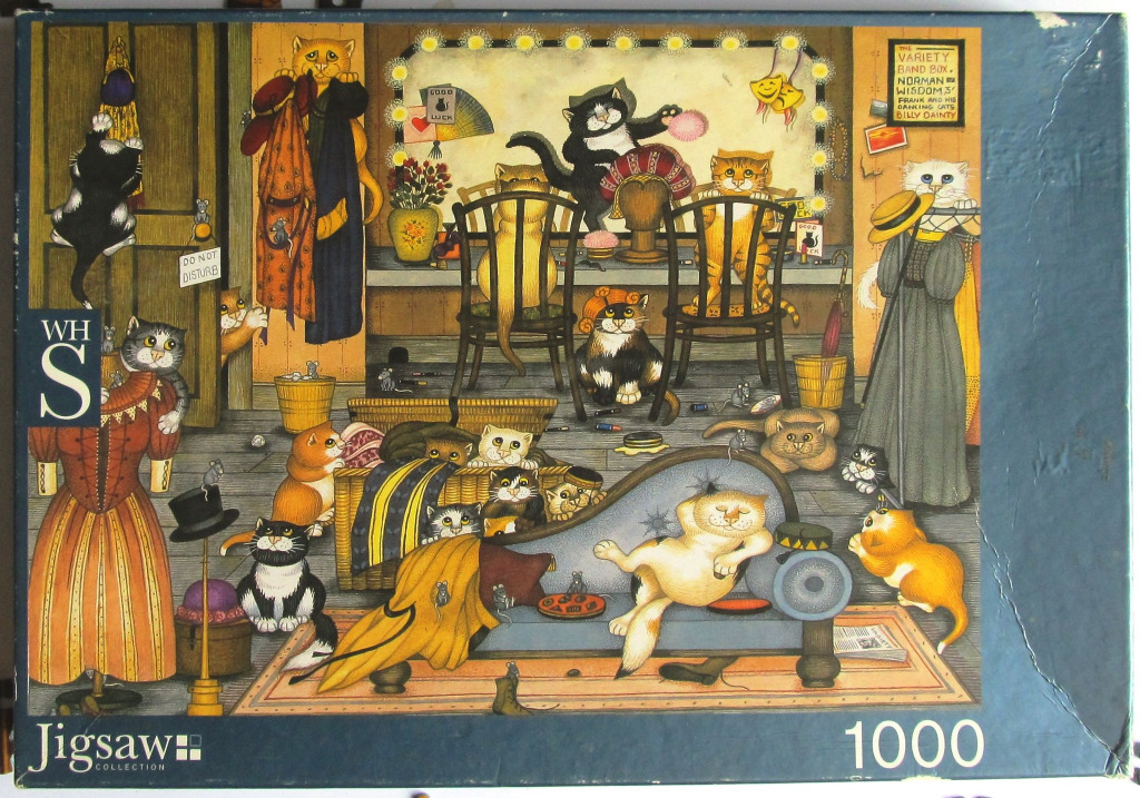 An illustration of many cats in a theatrical backstage dressing room.