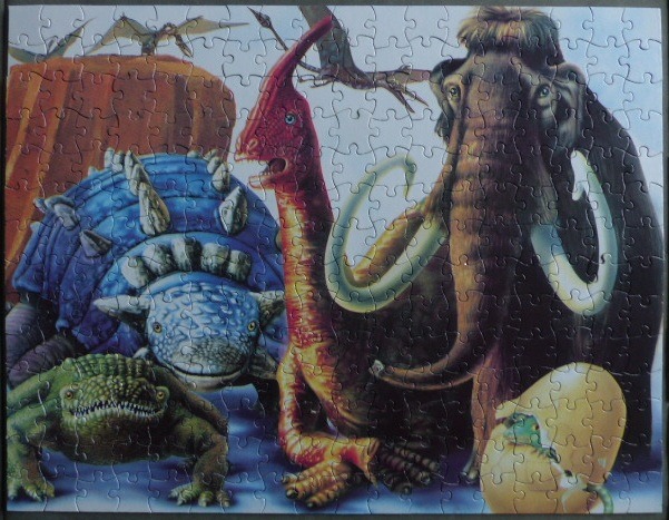 A group of prehistoric creatures including a mammoth, a dinosaur, and reptiles.