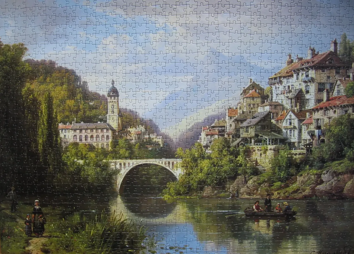 An oil painting of a European village built on hillsides flanking a river with a stone bridge and a boat.