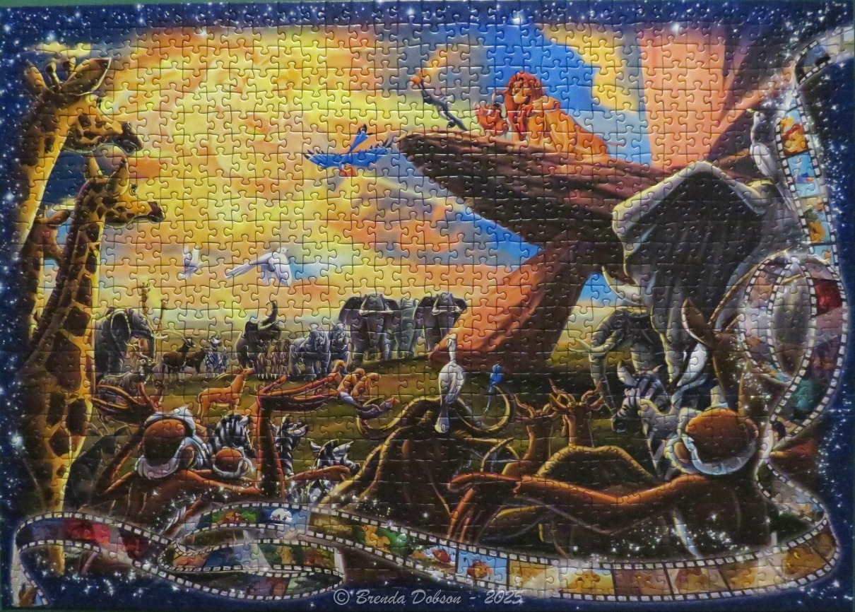 A montage of Lion King characters gathered on the African savanna under a starry sky, framed by film strips.