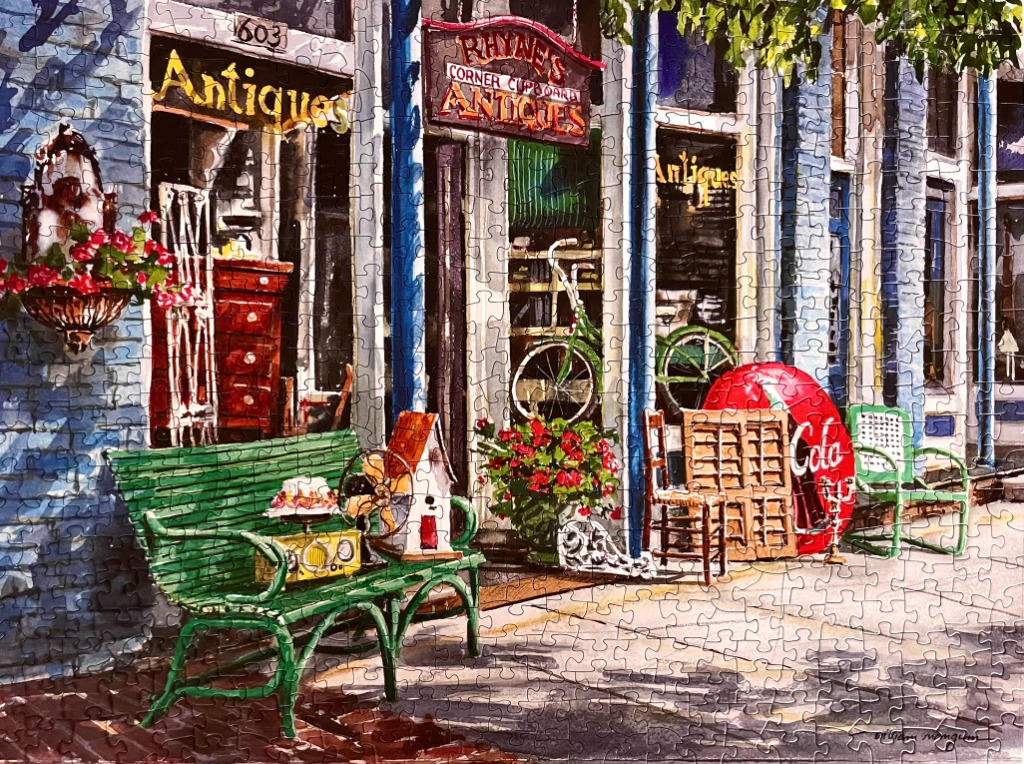 A charming watercolor painting of the storefront of Rhyne
