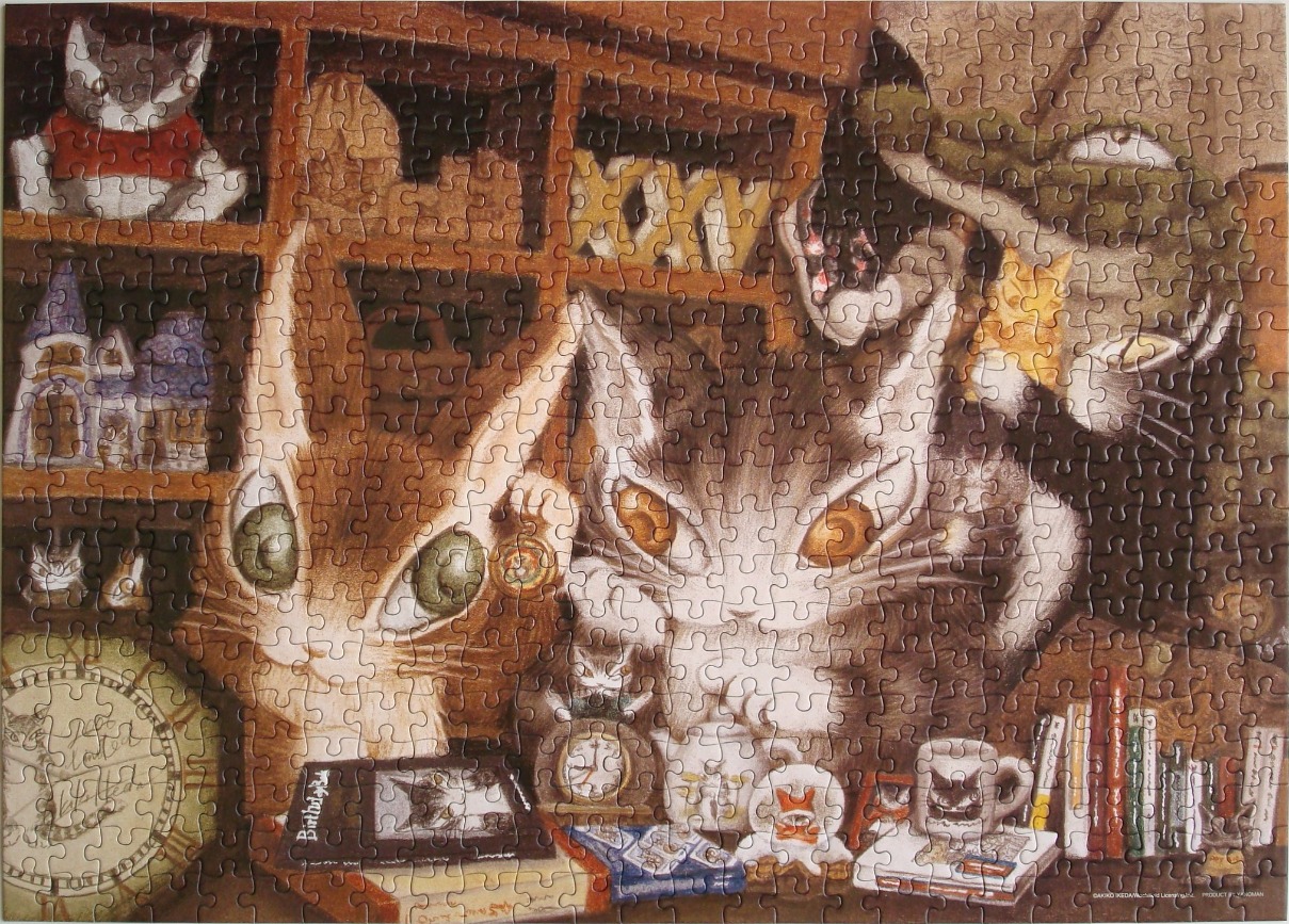 An illustration of two stylized cats with large, expressive eyes sitting in a room filled with books and trinkets.