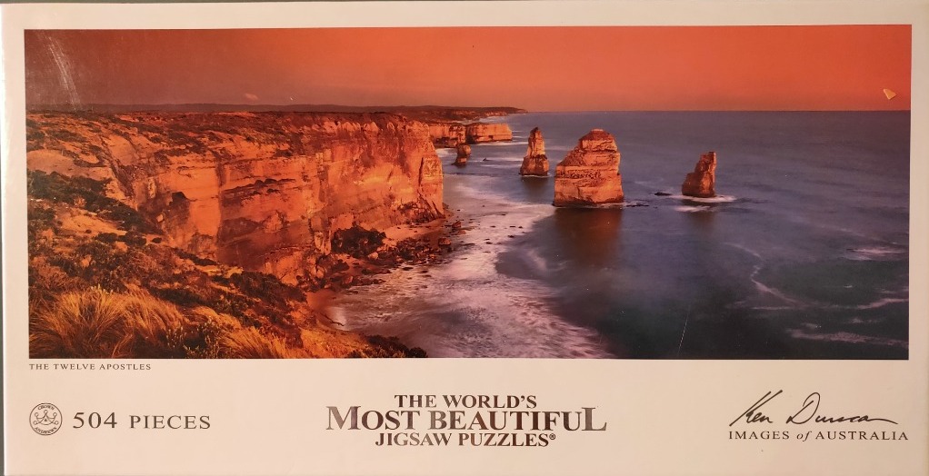 A panoramic photograph of the Twelve Apostles limestone stacks on the Australian coast at sunset.