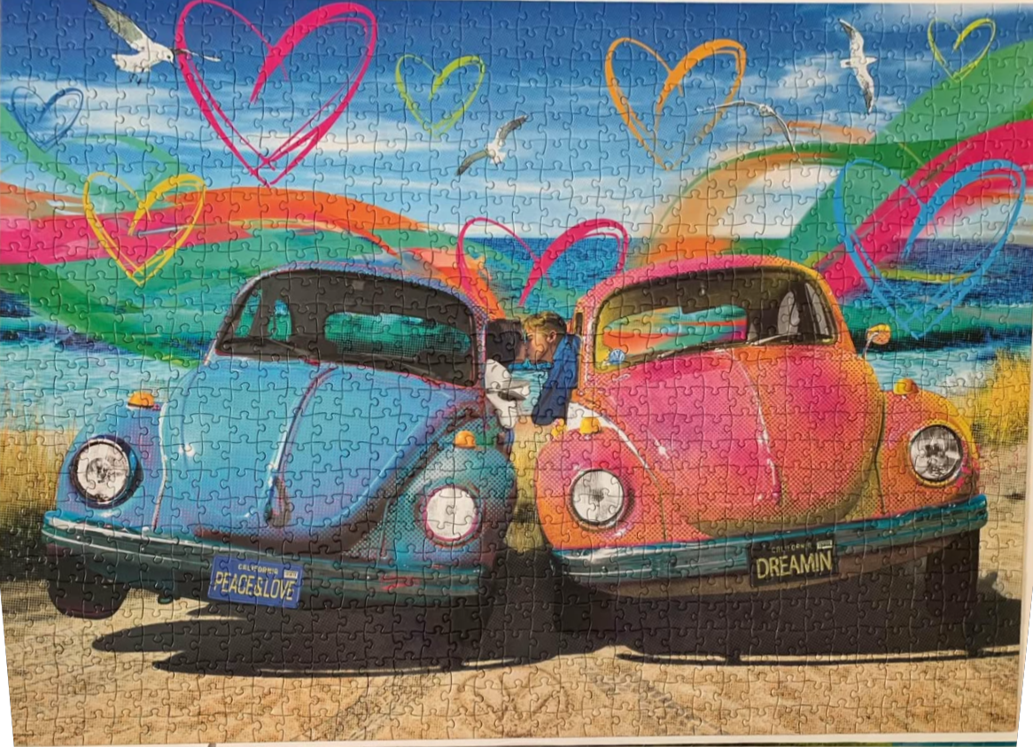 Two colorful vintage beetle cars parked on a beach with a couple kissing between them and stylized heart graphics.