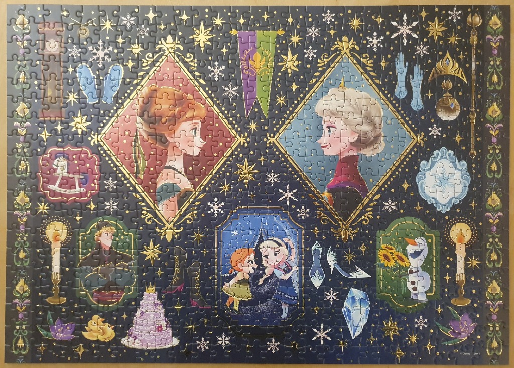 An illustrated montage of Frozen characters and motifs in a royal, star-studded dark navy frame.