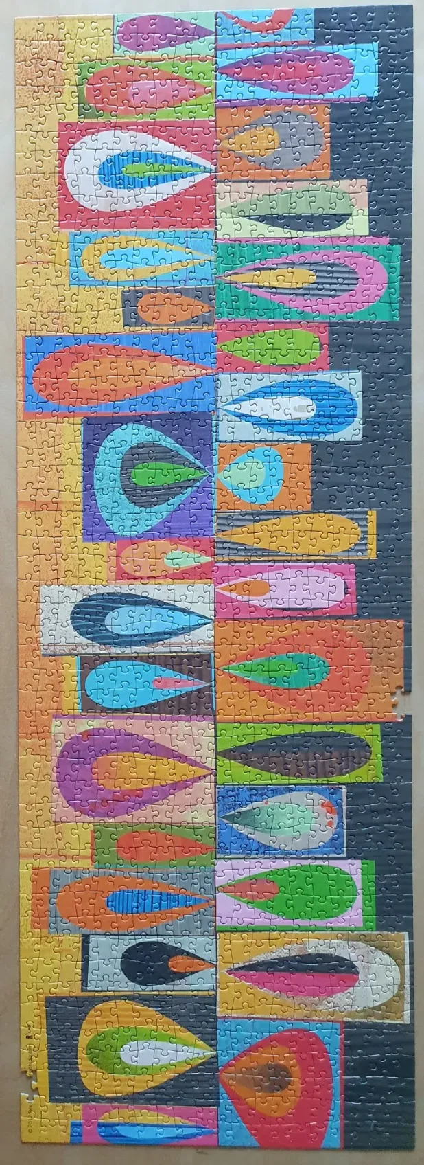 Abstract mid-century modern design featuring stacked rectangular cells with teardrop shapes in vibrant, layered colours.