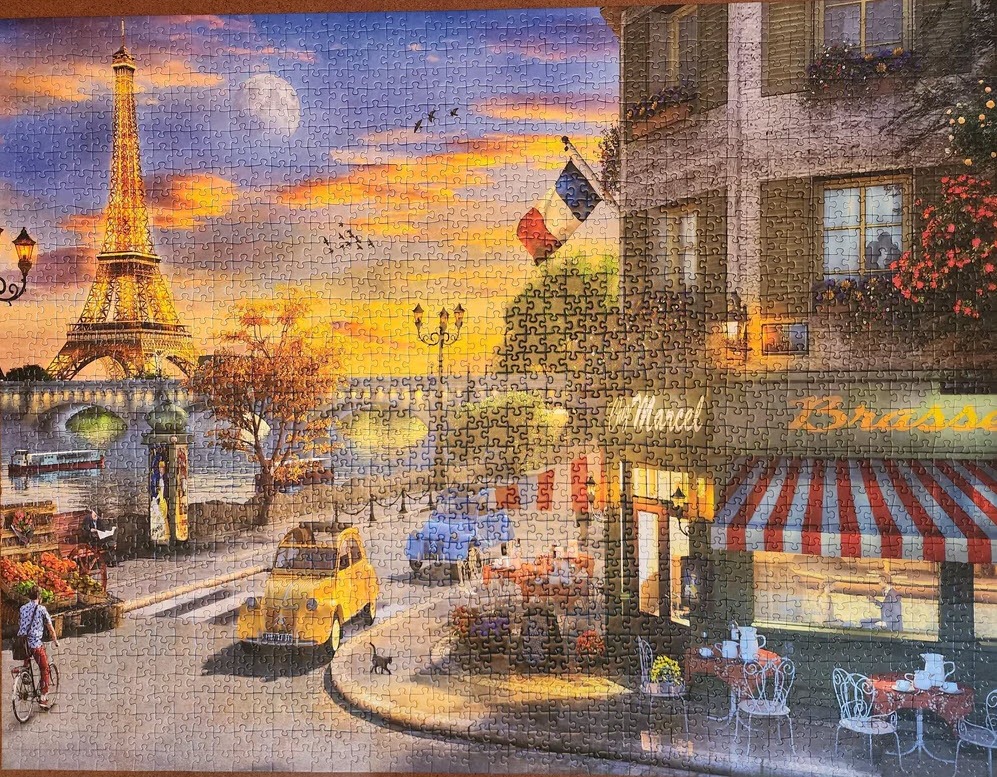 Romantic Parisian street scene at sunset featuring the Eiffel Tower, a yellow vintage car, and a cozy brasserie.