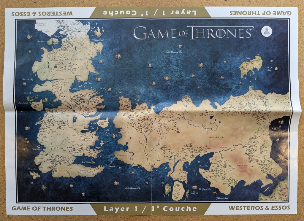 A detailed fantasy map of the continents of Westeros and Essos separated by a deep blue sea.