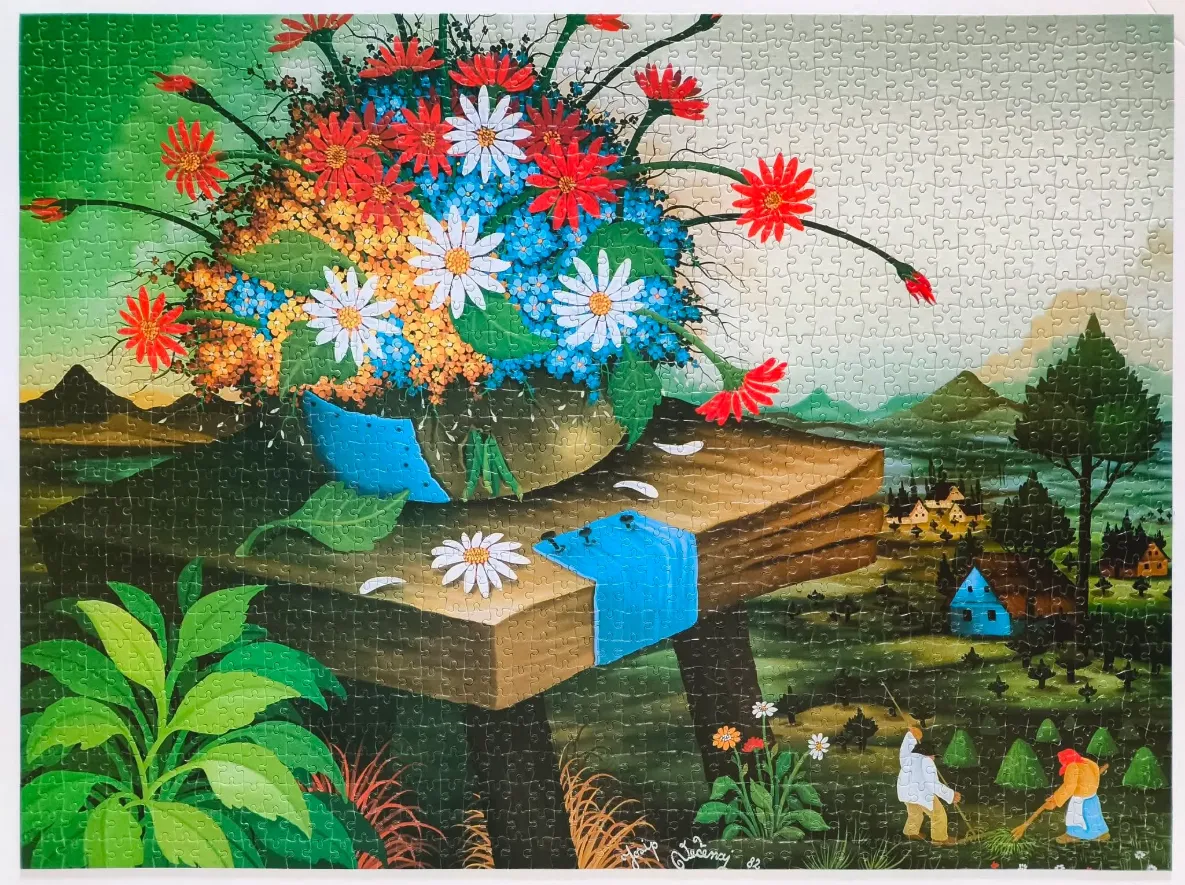 Naive-style folk art painting of a large vase of flowers on a wooden table overlooking a rural landscape.