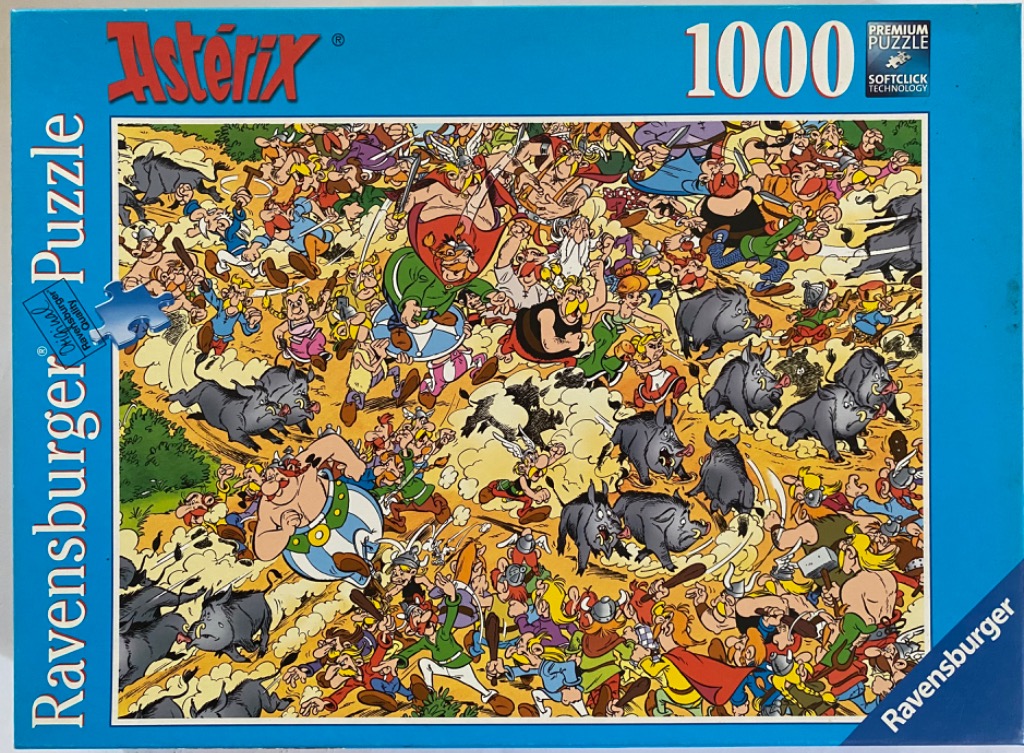 A chaotic, humorous cartoon illustration featuring Asterix, Obelix, and a village of Gauls chasing wild boars.