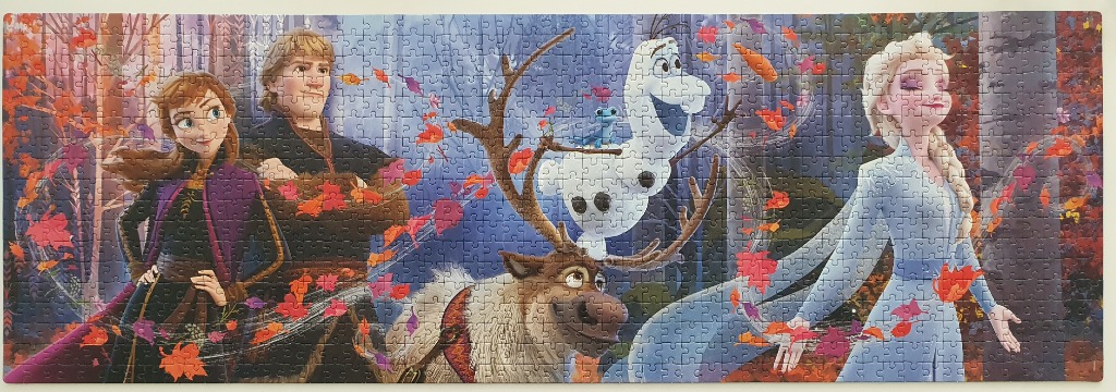 Animated characters Anna, Kristoff, Olaf, Sven, and Elsa in a fall forest setting.