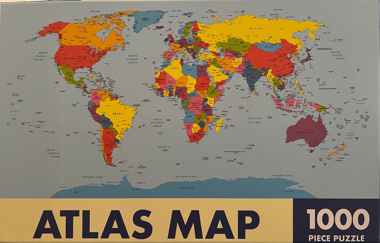 A colorful political world map featuring individual countries in contrasting shades of red, yellow, green, and blue.
