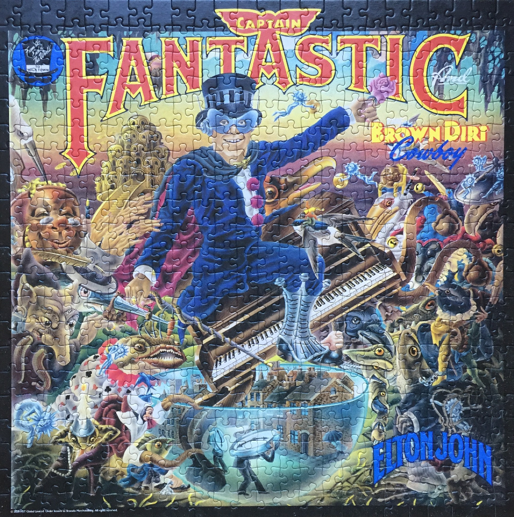 Illustration of Captain Fantastic and the Brown Dirt Cowboy album cover art featuring a colorful, surreal scene.