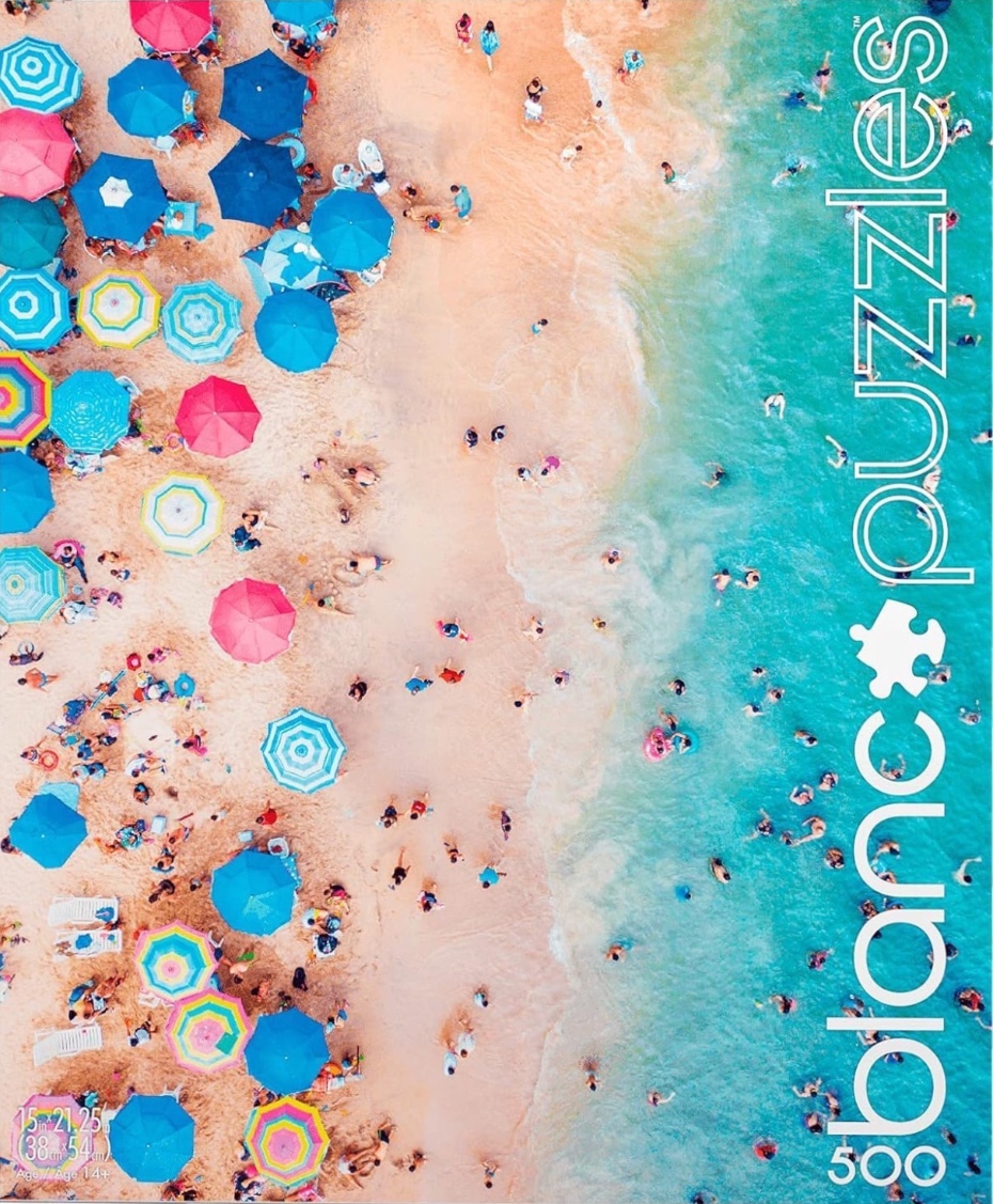 Aerial view of a crowded beach with vibrant umbrellas and turquoise water.