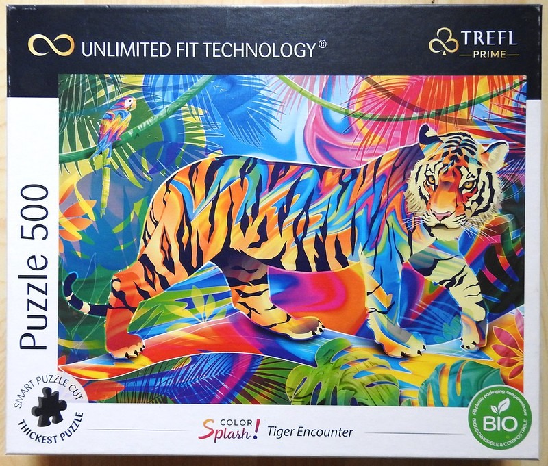 A psychedelic, multi-colored tiger standing in a vibrant tropical jungle with a small parrot nearby.