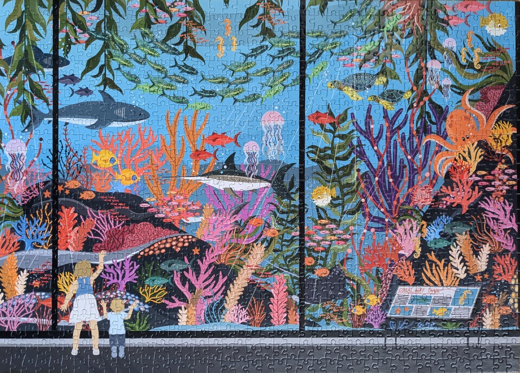 Illustration of two children looking into a large, colorful aquarium coral reef tank.