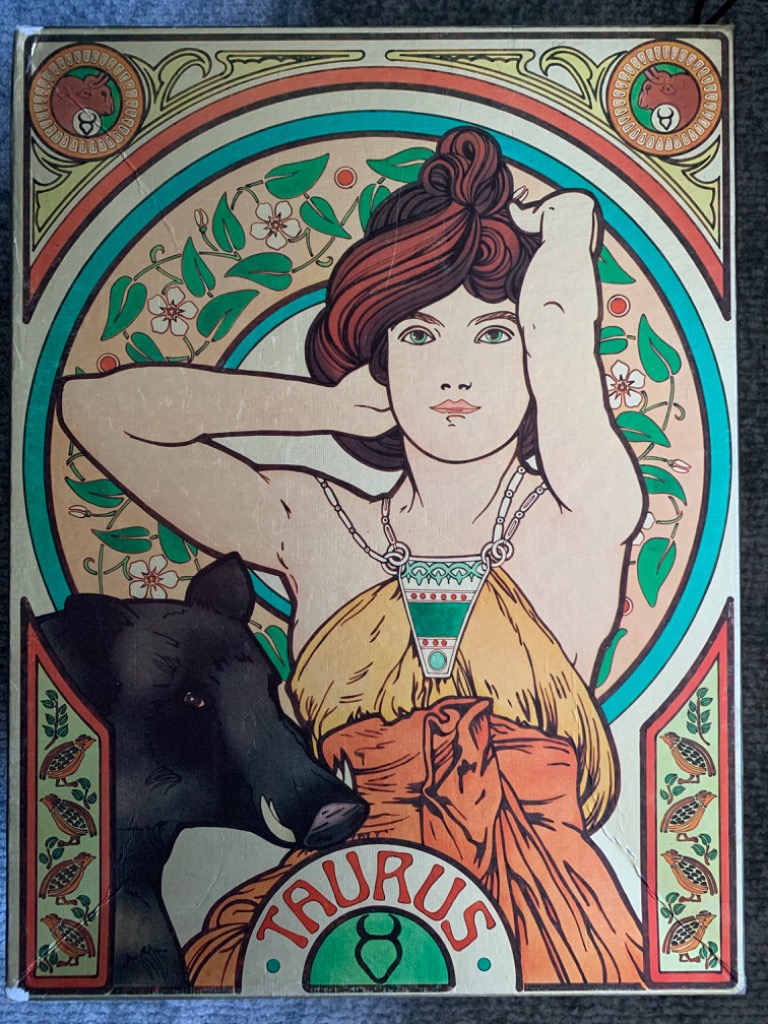An Art Nouveau-style illustration of a woman with a bull, representing the Taurus zodiac sign.