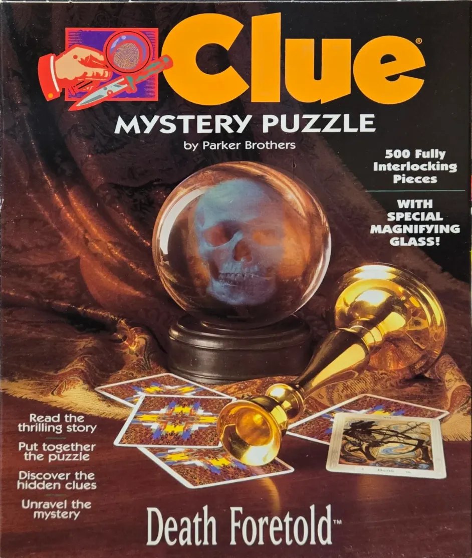 A crystal ball containing a ghostly skull, sitting on a dark fabric surface with a gold candlestick and tarot cards.