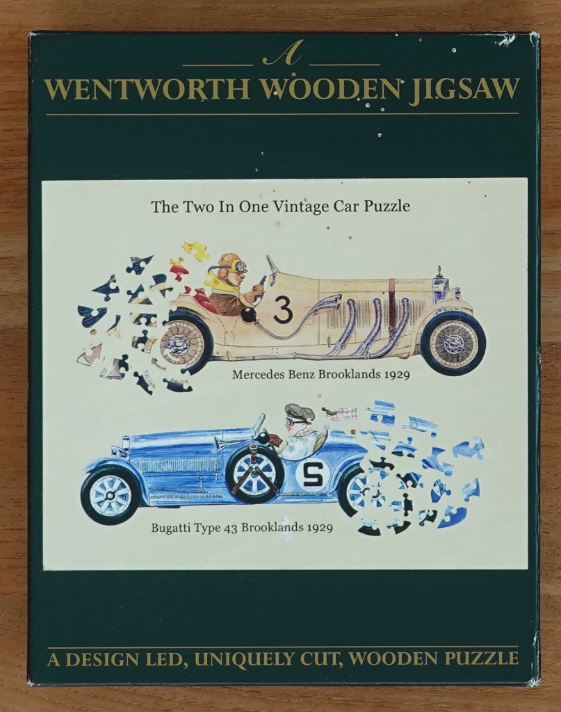 Illustration of a cream Mercedes Benz and a blue Bugatti, each partially transforming into jigsaw pieces.
