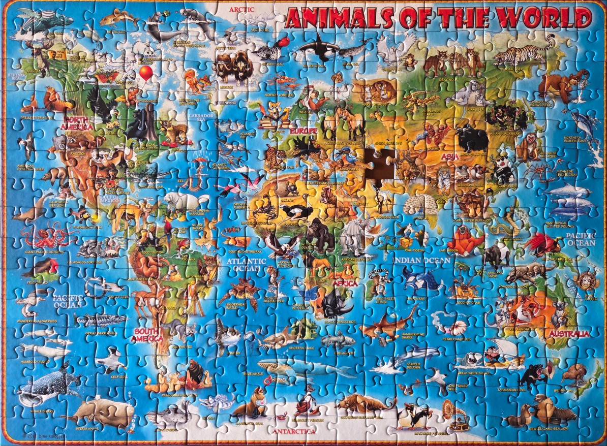 A colorful illustrated world map featuring various animals native to each region.