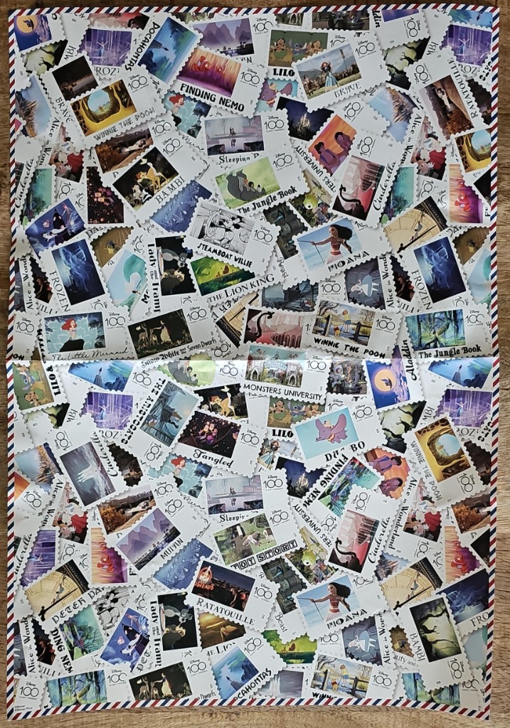 A collage of commemorative postage stamps featuring various animated characters.