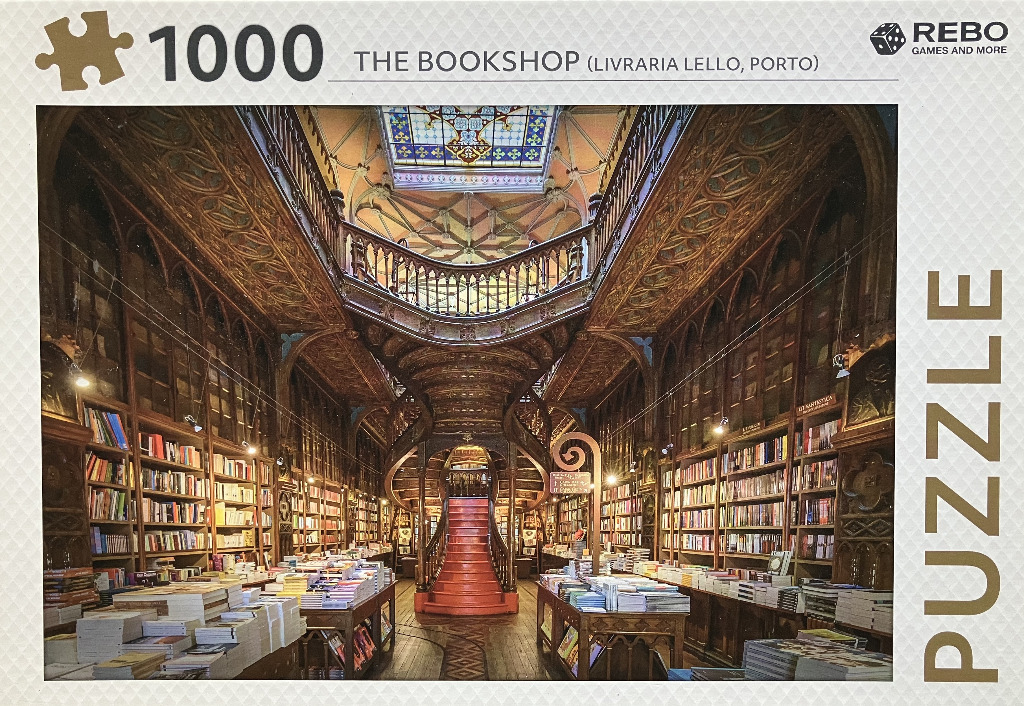 The ornate, wood-carved interior of the Livraria Lello bookstore in Porto, Portugal.