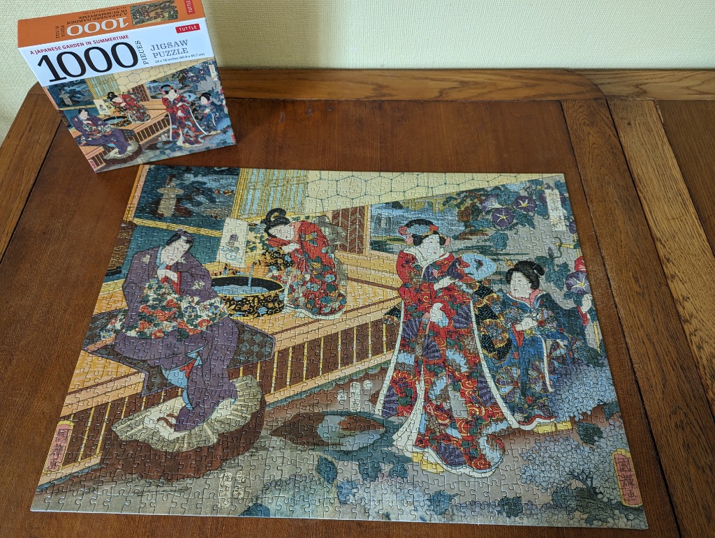 Traditional Japanese ukiyo-e style woodblock print featuring four women in a garden setting.