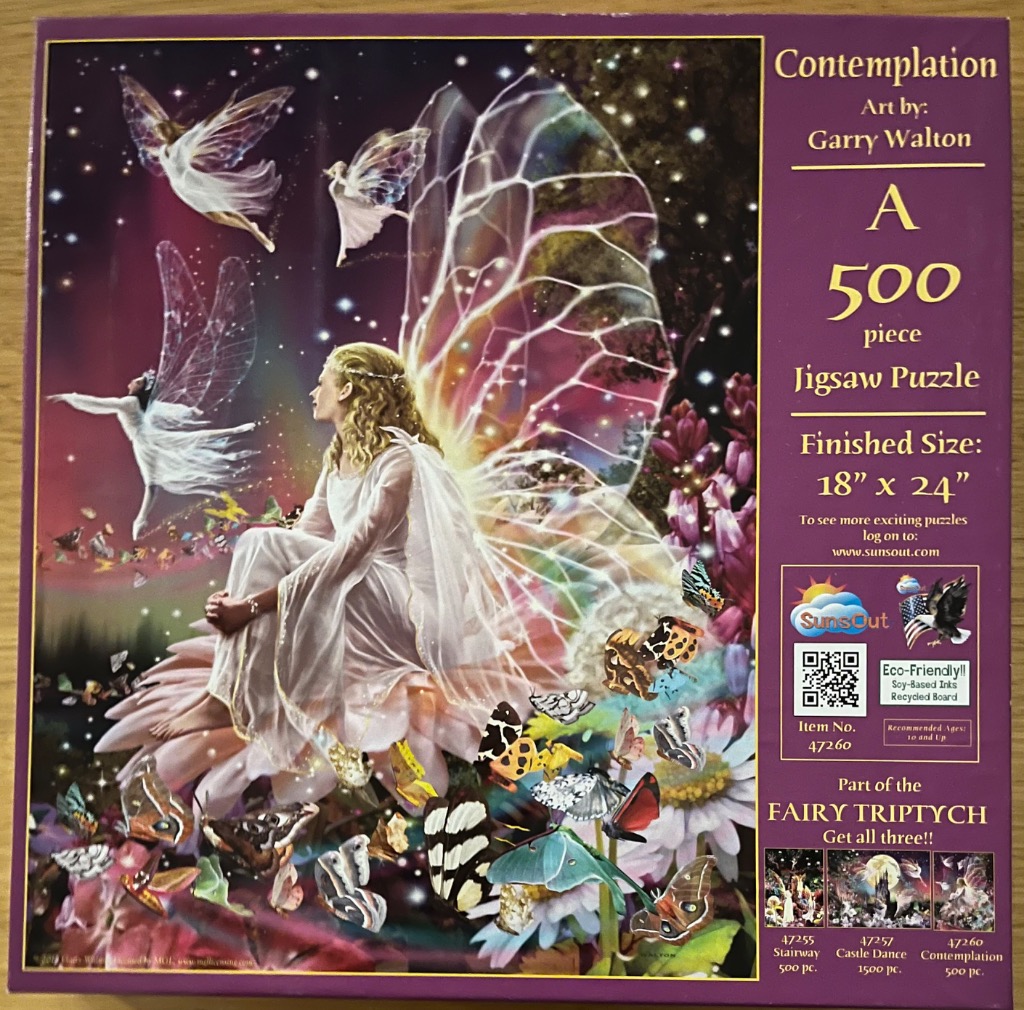 A fantasy illustration of a golden-haired fairy seated on a large flower, surrounded by smaller fairies and butterflies.