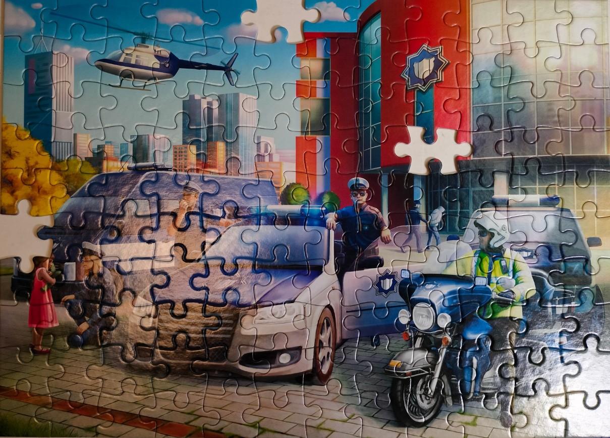 A digital illustration featuring police officers, squad cars, and a motorcycle outside a police station in a city.