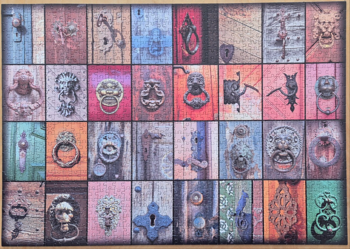 A collage of 32 different antique metal door knockers and hardware pieces set against colorful wooden door backgrounds.