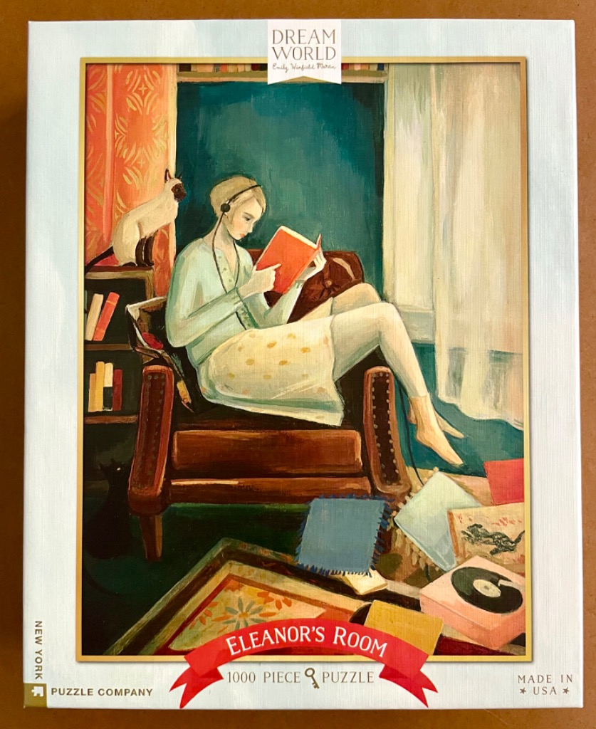 An oil painting of a woman in a light green cardigan sitting in a brown armchair reading a book with a Siamese cat nearby.