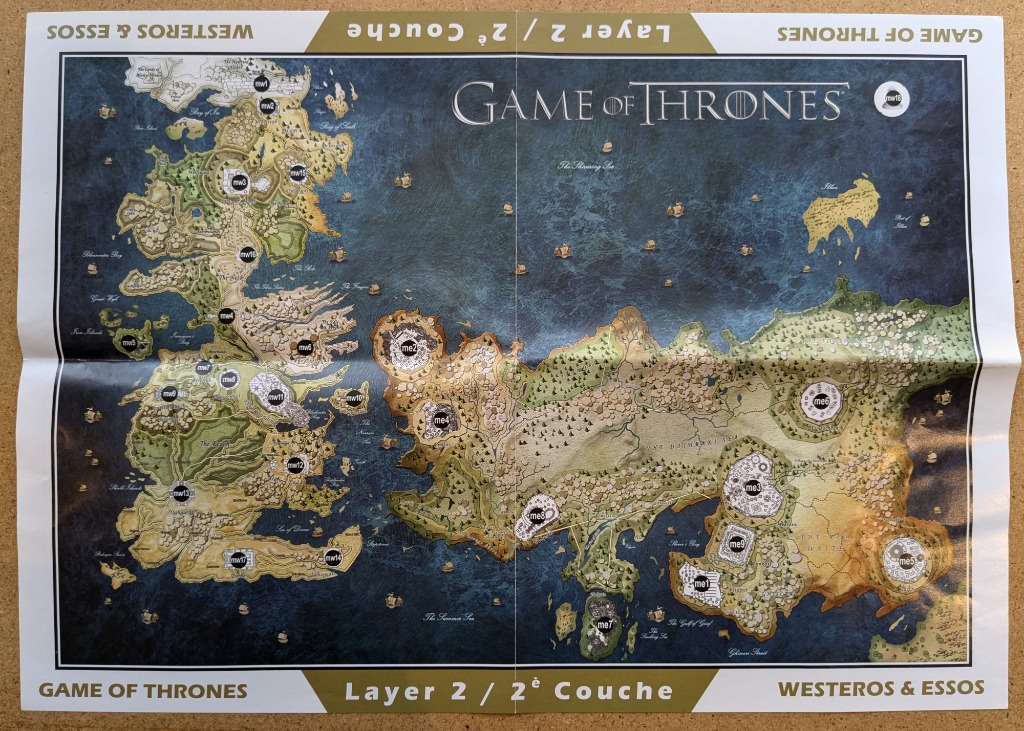 A fantasy map featuring two major continents separated by a sea, labeled with navigational markers.