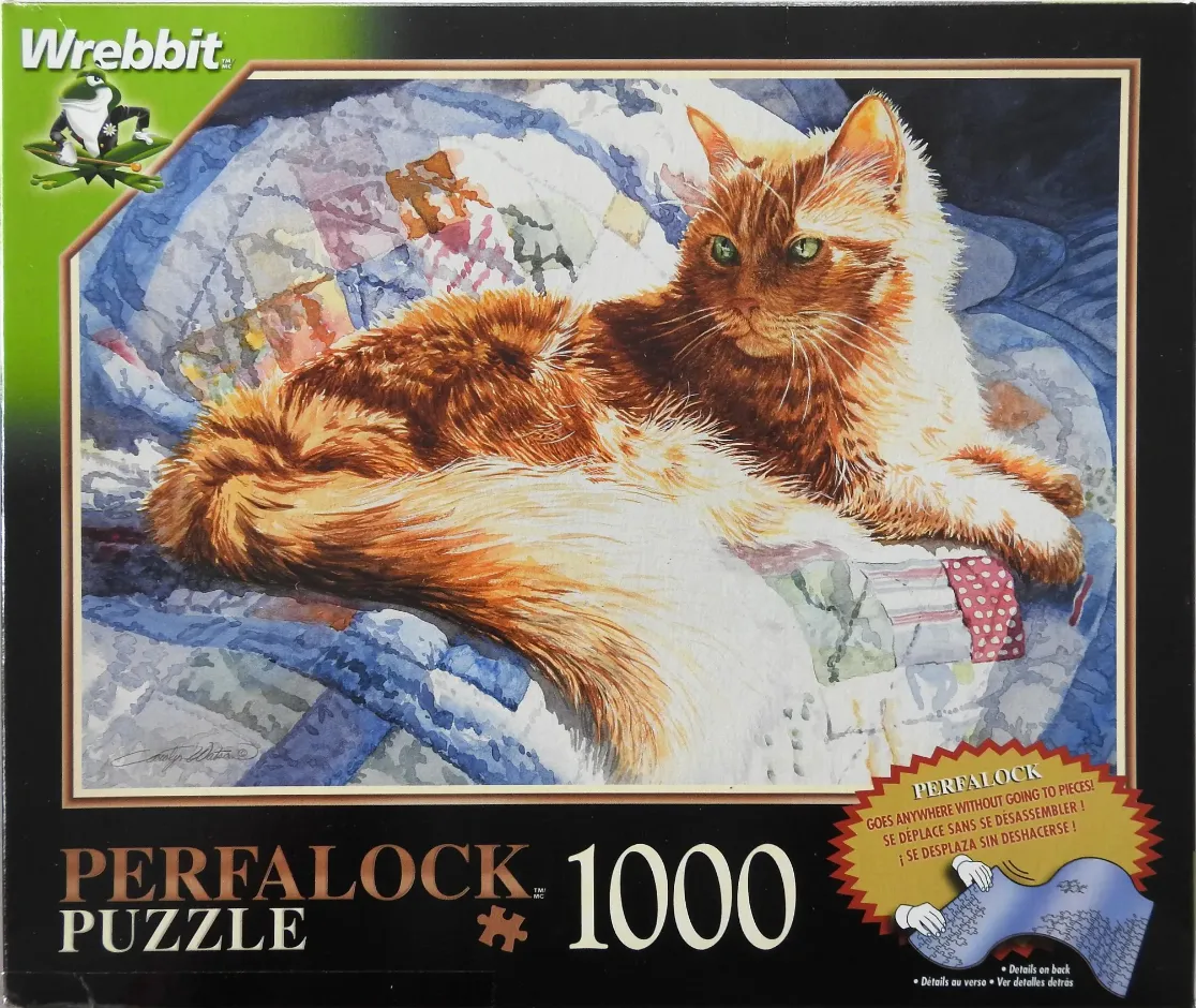 A watercolor painting of a fluffy ginger cat resting on a blue patchwork quilt.